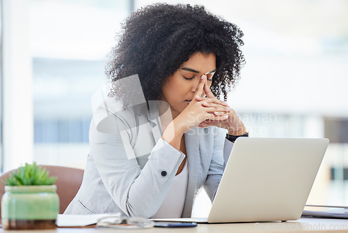 Image of Stress, anxiety and burnout with a business black woman at work using a laptop while suffering from a headache. Compliance, computer and mental health with a female employee struggling on a deadline