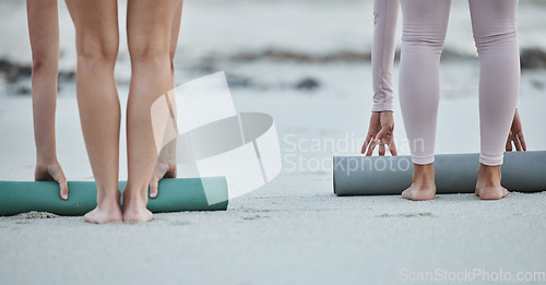 Image of Yoga mat, women legs and beach sand after fitness exercise, workout and balance training for peace, zen and calm mindfulness. People together outdoor in nature for morning pilates wellness routine