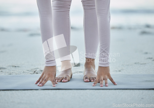 Image of Fitness, yoga and legs of woman at the beach for stretching, exercise and pilates training in nature. Mindfulness, motivation and hands and feet of girl for workout, balance and performance by ocean