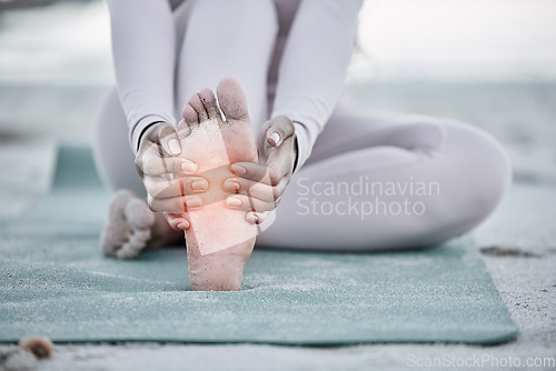 Image of Woman, foot pain and injury at beach after yoga practice, stretching or workout for health and wellness. Sports, pilates or female massage feet, fibromyalgia or muscle tension after exercise outdoors