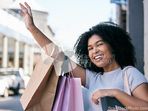 Image of Black woman while shopping with smile and shopping bag, wave in outdoor mall, hail taxi or transport in Rome, retail and customer. Young shopper in city, happy with designer brand and discount sale.