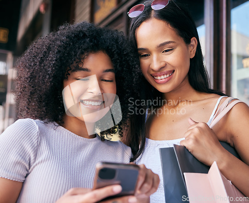 Image of Friends, phone and shopping in the city on a social network for retail discounts and sales. Cellphone, communication and friendship in a town for buying, purchase and luxury shopper females