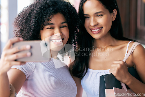 Image of Friends, phone and selfie while shopping with a smile, happiness and love for social media profile picture with influencer or content creator. Black female customers with smartphone for blog post