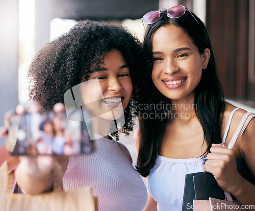 Image of Friends, shopping and selfie with wealthy women happy about fashion, clothing and apparel purchase. Friendship, mobile photo for social media while in a shopping mall in the city for retail sales