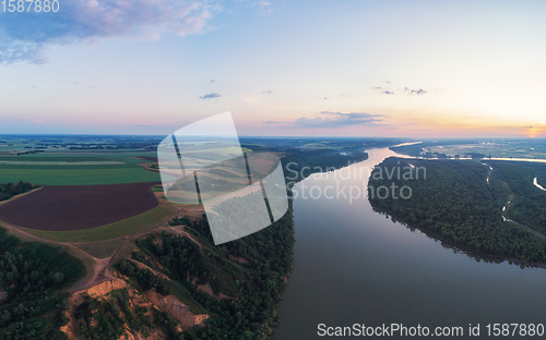 Image of Aerial drone view of river landscape in sunny summer evening