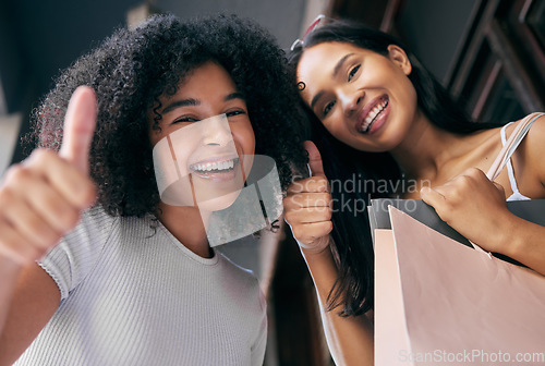 Image of Shopping, friends and thumbs up with women excited about successful retail deal or black friday sale. Bags, buying and gesture with friendship portrait in a shopping mall, department store or store