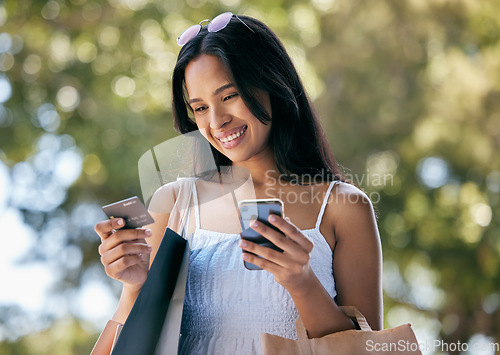 Image of Woman, phone and ecommerce with credit card for online shopping, sale or discount on internet. Girl, retail therapy and e commerce in summer with smartphone, web store or bank app tech in Los Angeles