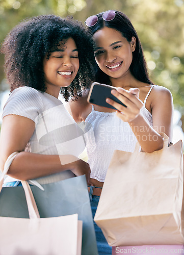 Image of Phone selfie, retail bag and shopping friends post memory picture, gift present or discount sales purchase to social media app. Mobile tech, commerce service or African customer girl on fashion spree