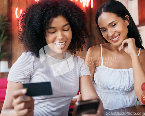 Image of Credit card, friends and women with phone for ecommerce, banking or payment in restaurant. Mobile smartphone, online shopping fintech and happy girls paying for order with debit card in coffee shop.