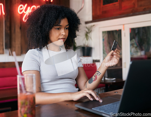 Image of Woman, laptop and credit card for banking payment in a cafe or restaurant with fintech. Pc, coffee shop and female paying for ecommerce online shopping order while buying with a debit card