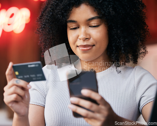 Image of Phone, credit card and woman doing retail online shopping for a sale, discount or promotion. Bank card, cellphone and lady from Puerto Rico buying clothes on a internet store, shop or boutique.