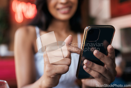 Image of Restaurant, bar and smartphone in hands of woman for social networking, mobile chat app and internet scroll, surfing or search. Cafe, young customer and using phone for social media post or an update