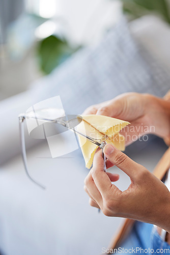 Image of Cleaning, glasses and dust with hands of woman for dirt, disinfection and ophthalmology. Fabric, frame and microfiber tissue with girl wipe spectacles lens for eye care, optometrist or antibacterial