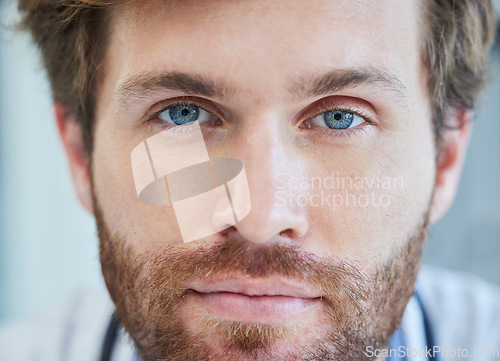 Image of Doctor, face and blue eyes in healthcare, medical or surgeon with vision for insurance at the hospital. Closeup portrait of male nurse professional head or optician ready for eye care or surgery
