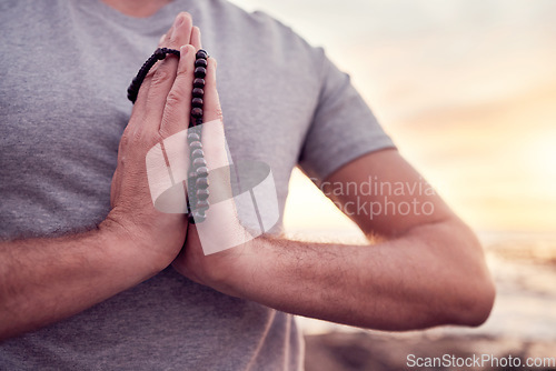 Image of Prayer, yoga or hands in gratitude in nature or beach for relaxing, peaceful or calm freedom in Bali. God, meditation or zen man praying for mindfulness, soul or holistic spiritual chakra energy