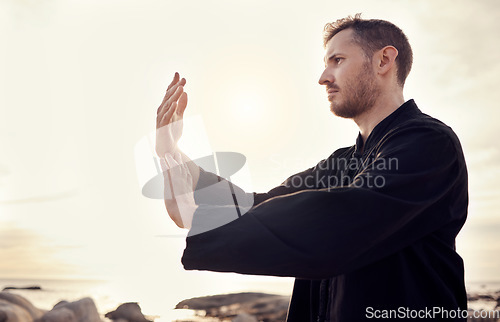 Image of Man, hands or relax tai chi on sunset beach in fitness, workout or training in mental health, chakra energy or mind balance. Zen, martial arts or person by ocean sea, nature water or sunrise exercise