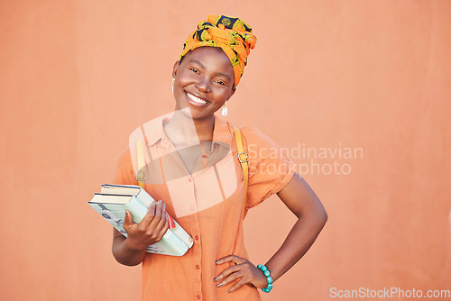 Image of Student, books and portrait of black woman on orange wall background ready for education, learning and knowledge. African fashion, youth and girl ready for college, university and academy in Nigeria