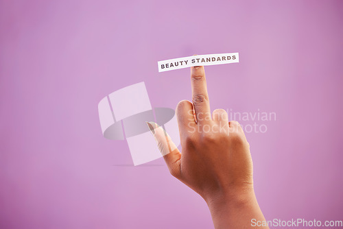 Image of Woman, middle finger and beauty standards on studio background to protest opinion, society review and stereotype. Mockup, rude hand gesture and sign for anger, revolution and freedom of body ideals
