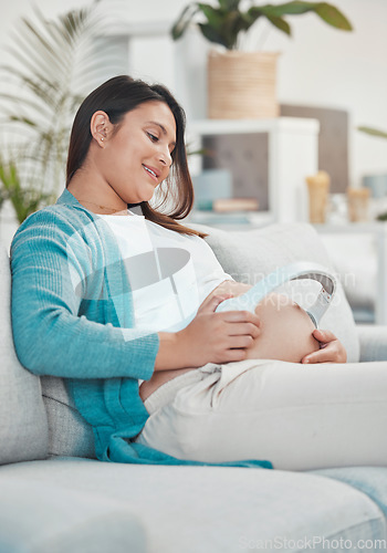 Image of Pregnant, mother and headphones on stomach for baby to listen to music for relax and growth. Musical audio, headset and pregnancy with a woman playing songs or the radio for her unborn child