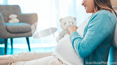 Image of Relax, happy and pregnant woman with teddy bear in baby nursery excited for motherhood. Pregnancy belly of girl resting on floor in home with smile holding fluffy toy for future child.