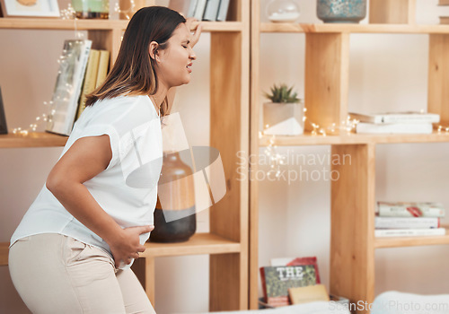 Image of Woman in labor, birth and pregnant with pain and water break at family home, pregnancy and new mom. Childbirth, stomach pain and pregnant woman health, prenatal care and maternity with new mama.