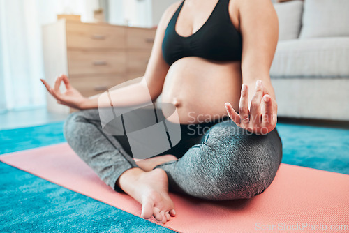 Image of Yoga, pregnant and woman with meditation, lotus pose and peace, zen and calm with mindfulness, exercise for prenatal health. Self care, wellness and pregnancy fitness, pregnant woman and balance.