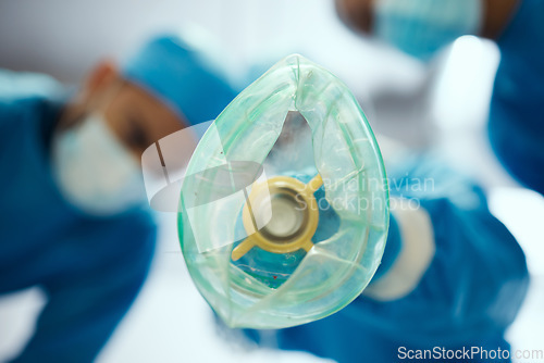 Image of Closeup oxygen mask, ventilation and doctors in hospital of emergency healthcare, surgery or medicine in operating room. Breathing machine, ventilator and air for patient, lungs and medical operation