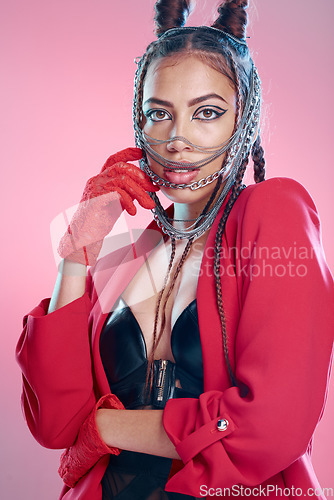 Image of Woman, bdsm fashion and portrait in studio for makeup, erotic clothes or sexy chain mask by pink background. Black woman, punk or metal jewelry for aesthetic with beauty, cosmetics or rock