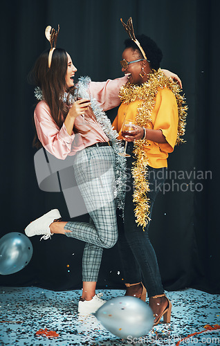 Image of Women friends, party and night with balloons, tinder or wine in new year, celebration or happiness. Woman diversity, hug and glass for drinks, happy or dark background for glitter confetti on floor