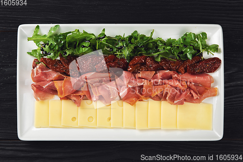 Image of prosciutto cheese and sun-dried tomatoes