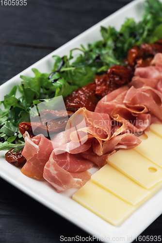 Image of prosciutto cheese and sun-dried tomatoes