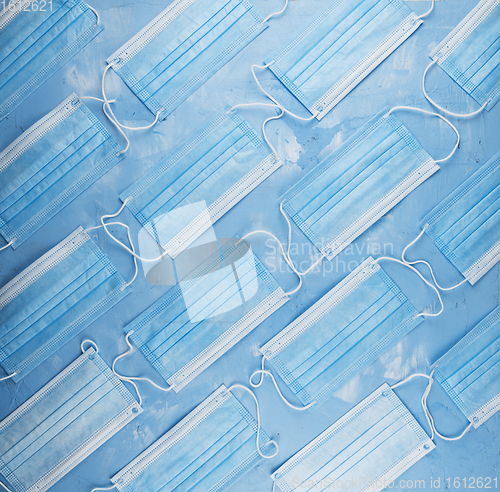 Image of Medical masks on the blue colored background