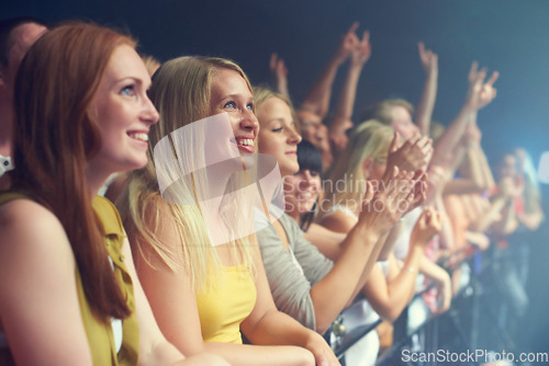 Image of Women, music show and audience of concert event ready for band performance at a music festival happy. Friends, night and happiness of fans and group at a rock, punk or celebration at new year