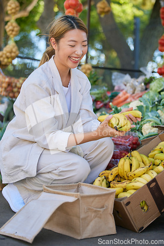 Image of Bananas, shopping and Asian woman at outdoor market buying delicious and healthy fruits. Plantains, products and female from Japan purchasing fruit at street stall for vitamin c, health and wellness.