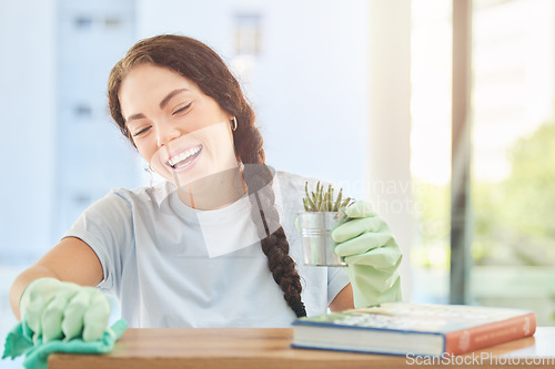 Image of Cleaning, fabric and smile with woman and desk at home for housekeeping, hygiene and disinfection. Dirt, dust and bacteria with girl cleaner wiping with cloth for sanitary, domestic and washing