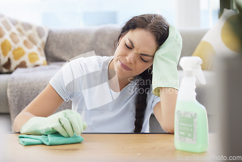 Image of Housekeeping, depression and woman tired from cleaning furniture, dust and dirt in apartment living room. Housework, spring cleaning and sad, depressed girl with detergents, spray bottle and cloth