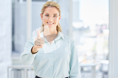 Image of Leadership, success or business woman with thumbs up after review, financial report or sales goals in office building. Smile, hand or portrait of a happy employee with growth mindset, pride or praise