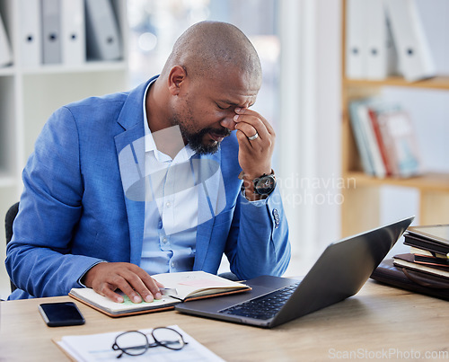 Image of Headache, stress and businessman on laptop in his office with accounting management, finance planning and company kpi review. Burnout, sad and depression of a corporate black man with pain or problem