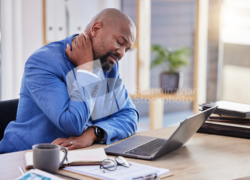 Image of Black man , stress and tired burnout with neck pain in the office due to bad posture and uncomfortable chair. Fatigue, problem or frustrated worker annoyed with body injury or muscle backache at work