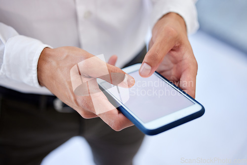 Image of Phone screen, mockup space or social media while typing hands of a businessman in a office. Zoom hand of worker browsing, send text or sms message or emails while at work with mock up advertising