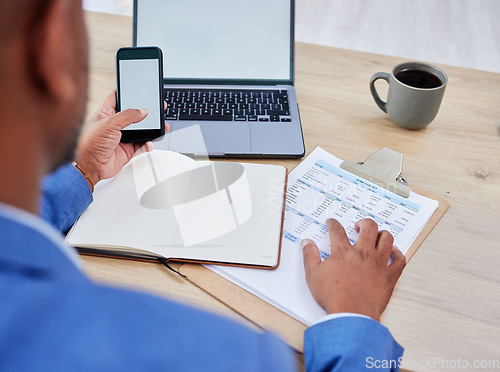 Image of Phone, laptop and mockup of man finance planning, budget and fintech for banking, loan or mortgage application. Accounting, website and management black man with financial, tax and invoice documents