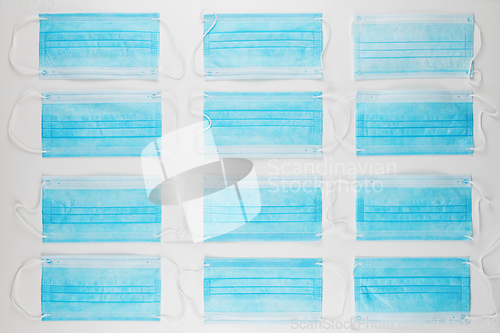 Image of Medical masks on the blue colored background