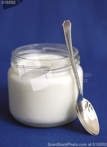 Image of yogurt on blue background