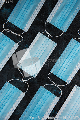 Image of Medical masks on the blue colored background