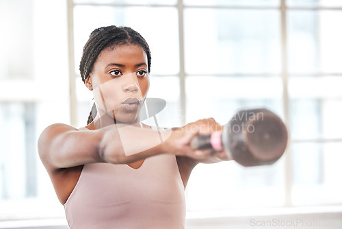 Image of Fitness, breathing and black woman with kettlebell, body builder and weight training in gym, exercise and focus. Athlete, weightlifting and breath with wellness and strong, muscle and workout studio.