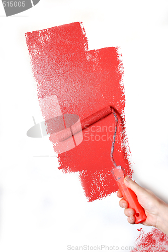 Image of painting a wall with a roll