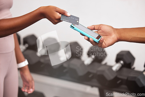 Image of Gym, hand and card for nfc payment online for fitness subscription or membership bill. Tap, scan and debit card with a fit woman paying for exercise and training bill with fintech in her healthclub