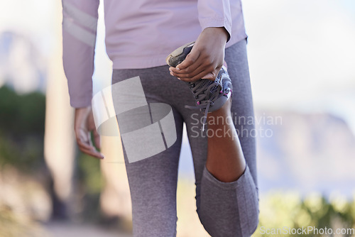 Image of Stretching, running and shoes of black woman in nature for training, fitness or cardio endurance. Stamina, jogging and workout with girl runner and warm up on mountain path for exercise performance