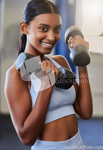 Image of Fitness, Indian woman and dumbbell training portrait in gym for workout training, exercise motivation and healthy lifestyle. Sports wellness, muscle bodybuilder and athlete woman happy in health club