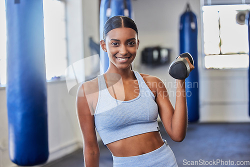Image of Happy woman, fitness and dumbbell exercise in gym for strong body, wellness and healthy lifestyle goals. Portrait of indian female, sports and happiness with weights for workout, training and power